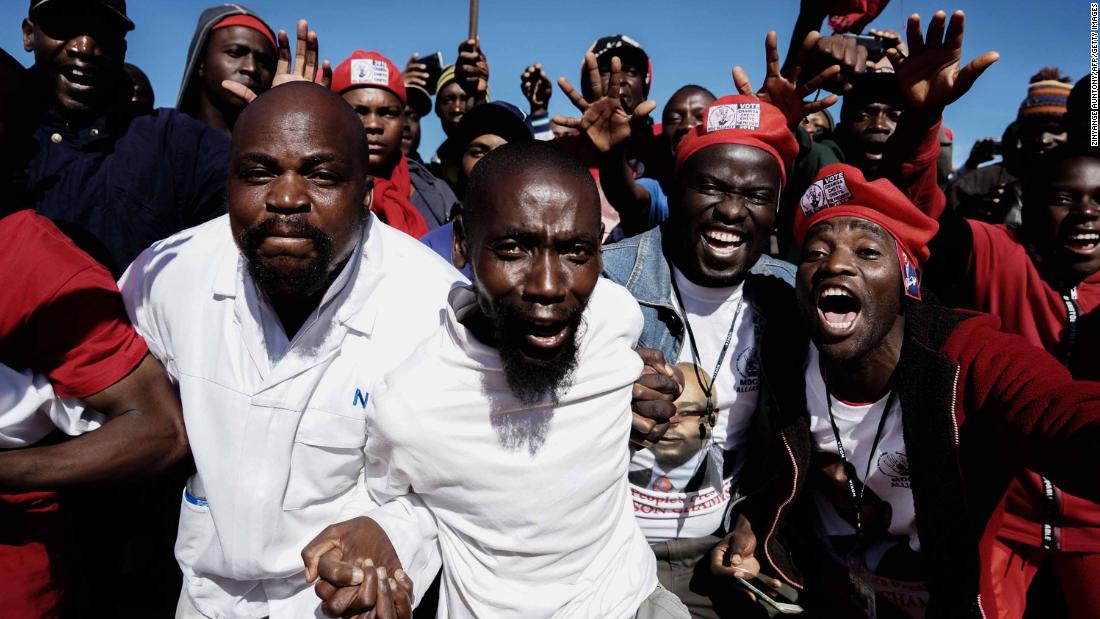 Movement for Democratic Change supporters cheer as they gather to listen to their leader Nelson Chamisa.