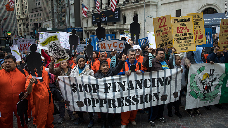 Protesters called on Wall Street to stop bankrolling private prisons at a May Day march in Manhattan. 