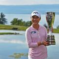 Lydia Ko of New Zealand holds the trophy after winning the Evian Championship Golf 