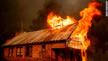 Flames engulf a historic schoolhouse Thursday in Shasta, California.