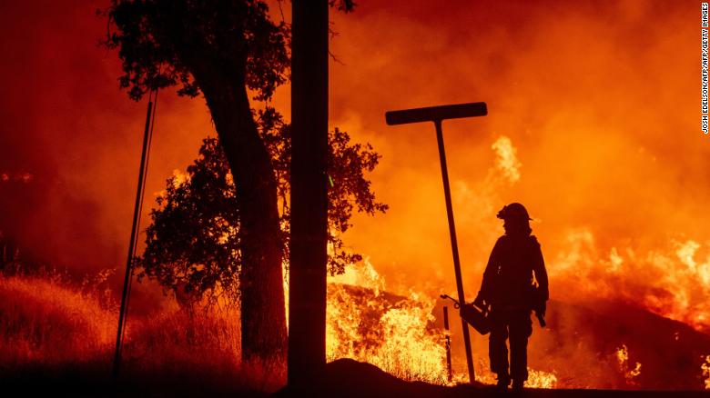 A firefighter battles the Carr fire in Redding, California.