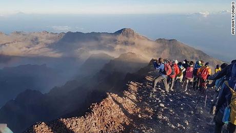 Anuwat Kongko, a 28-year-old hiker from Thailand, was on top of Mount Rinjani when the earthquake hit.
 
&quot;I reached the summit [Mont Rinjani] at around 6am along with some friends. Then I spent some time taking pictures with my camera with my friends until 6.47am, when the 1st earthquake occurred. It&#39;s just like the mountain was shaking. Everyone crouched on the floor and after it stopped I started to run away from there.
 
&quot;After 10minutes an aftershock happened. Then, everyone was told to move out from there pretty quickly (you can see it in my video). Some of the pathway was destroyed by the earthquake.&quot;
 
Kongko said it took them 1 hour to get from the summit to the camping area, and 3 hours from the camping area to the village.
