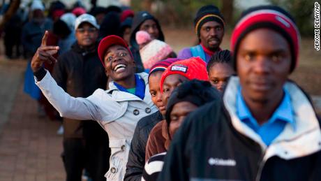Zimbabweans line up to vote at the Fitchela Primary School in Kwekwe on Monday. 