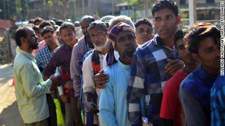 Assam is the only state in India to have a citizenship register. Villagers in Assam stand in line to check their names on the first draft of NRC in 2018.