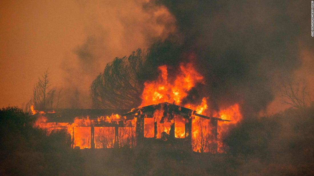 A house near Finley burns from the Mendocino Complex Fire on July 30.