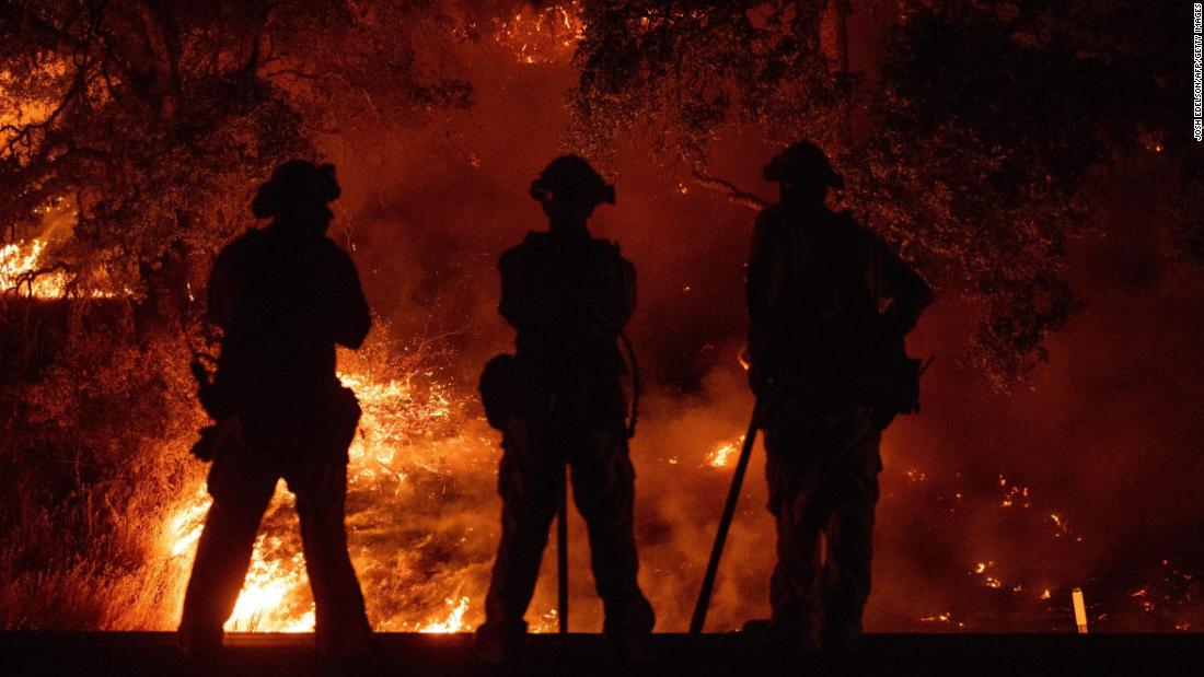 Firefighters in Upper Lake watch a back burn on July 31.