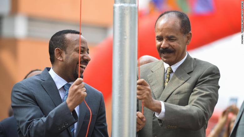Abiy, left, and Eritrean leader Isaias Afwerki celebrate the Eritrean Embassy&#39;s reopening in Addis Ababa.