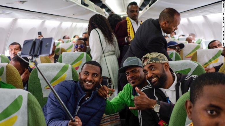 Passengers pose for a selfie inside an Ethiopian Airlines flight from Addis Ababa, Ethiopia, to Eritrea&#39;s capital Asmara on July 18. It was the first commercial flight from Ethiopia to Eritrea in two decades.
