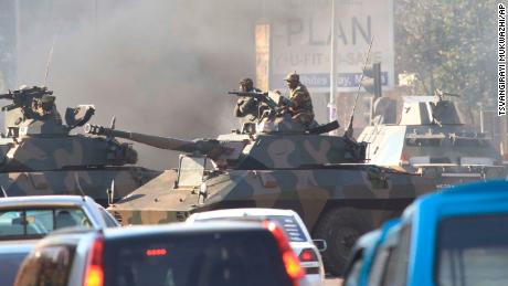 Tanks patrol the streets of the Harare.