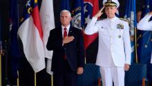 Vice President Mike Pence attends a ceremony wit Commander of U.S. Indo-Pacific Command Adm. Phil Davidson marking the arrival of the remains believed to be of American service members who fell in the Korean War at Joint Base Pearl Harbor-Hickam, Hawaii, Wednesday, Aug. 1, 2018. (AP Photo/Susan Walsh)