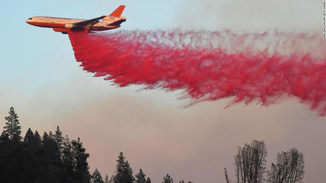 An air tanker drops fire retardant near Redding on August 2.