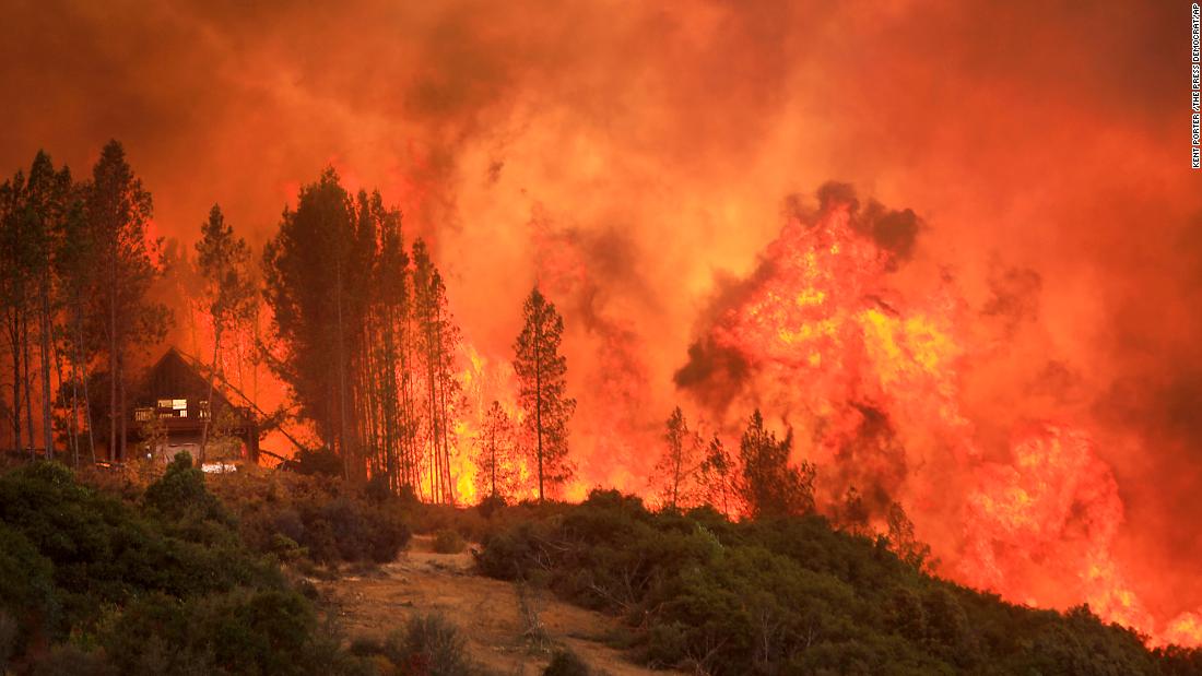 Flames from a wildfire move up a ridge near Lakeport on August 2.