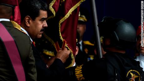 Venezuelan President Nicolas Maduro (left) at the ceremony where the attack occured.