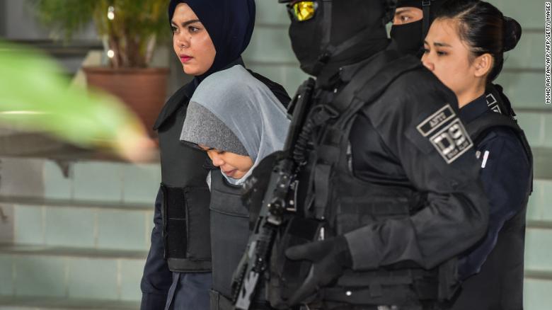 Siti Aisyah (center) is escorted by Malaysian police after a court session for her trial at the Shah Alam High Court in Shah Alam, outside Kuala Lumpur on June 27.