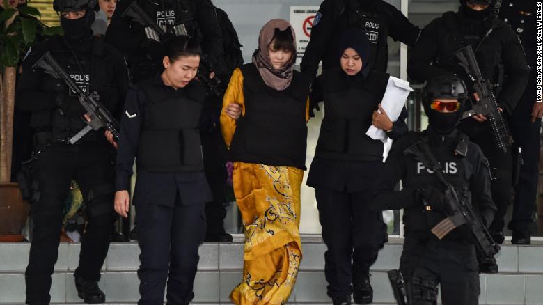 Doan Thi Huong (center) is escorted by Malaysian police at the Shah Alam High Court in Shah Alam, outside Kuala Lumpur on June  27.