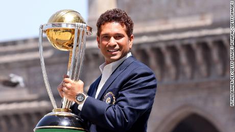 Sachin Tendulkar poses with the  ICC Cricket World Cup Trophy in 2011.