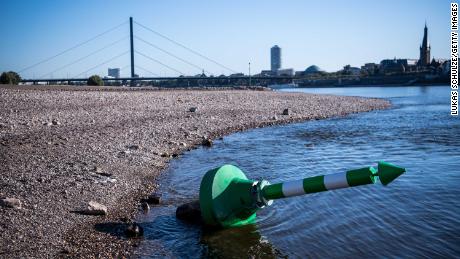 A buoy lies on the dry Rhine riverbed on a searing hot day in Dusseldorf, Germany, in August. 