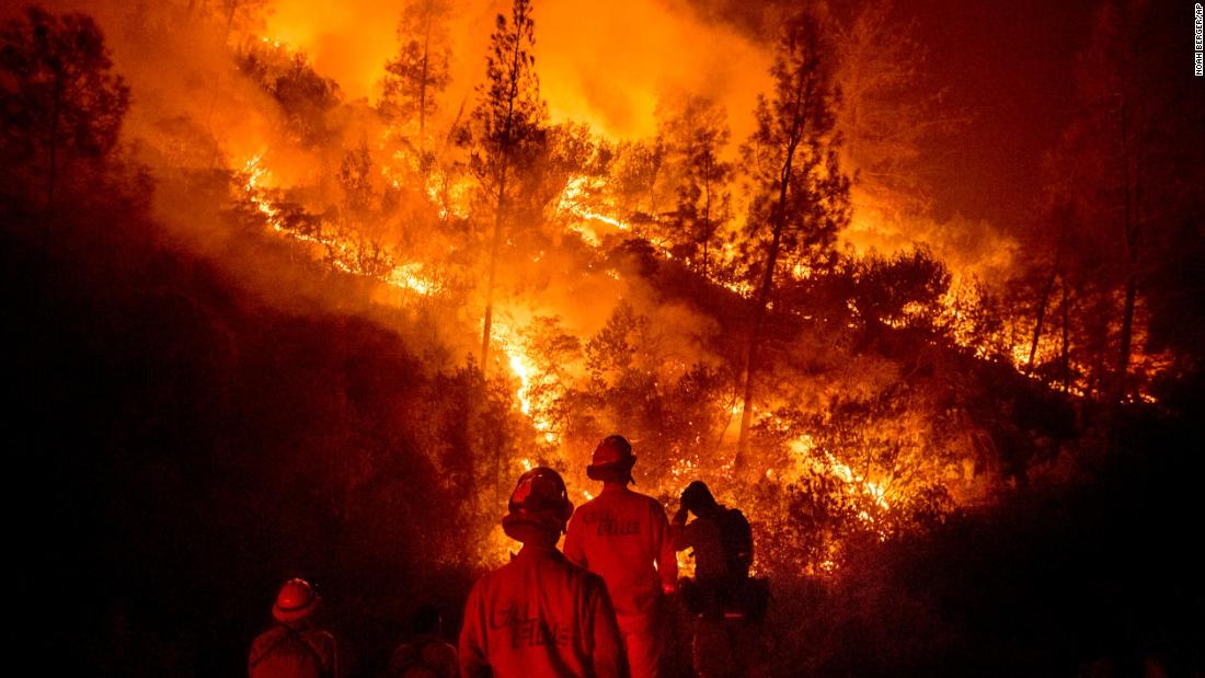 Firefighters monitor a backfire while battling part of the Mendocino Complex Fire near Ladoga on Tuesday, August 7.