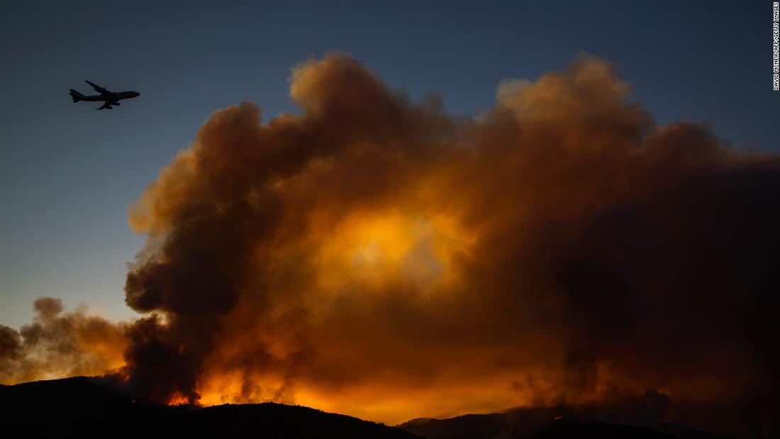 A supertanker jet flies above the Holy Fire near Lake Elsinore on August 7.