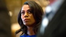 Omarosa Manigault, a staffer for US President-elect Donald Trump, listens as Martin Luther King III speaks to the media after meeting with the President-elect at Trump Tower in New York City on January 16, 2017.  / AFP / DOMINICK REUTER        (Photo credit should read DOMINICK REUTER/AFP/Getty Images)