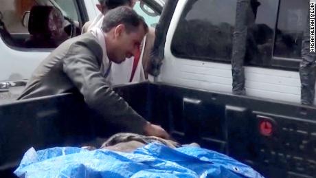 Dad finds the body of his son killed in airstrike