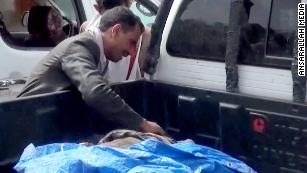 Dad finds the body of his son killed in airstrike