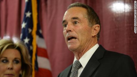 Chris Collins, with his wife Mary at his side, holds a news conference in response to his arrest for insider trading on August 8, 2018 in Buffalo, New York. 
