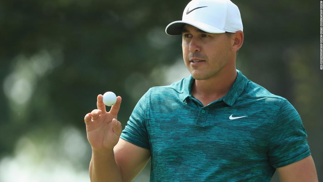 Brooks Koepka of the United States acknowledges the crowd after making a putt for birdie on the ninth green during his triumphant final round of the 2018 PGA Championship at Bellerive Country Club.