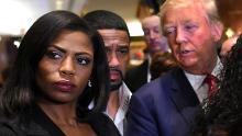 Omarosa Manigault (L)  who was a contestant on the first season of Donald Trump&#39;s &quot;The Apprentice&quot; and is now an ordained minister, appears alongside Republican presidential hopeful Donald Trump during a press conference November 30, 2015  that followed Trump&#39;s meeting with African-American religious leaders in New York. AFP PHOTO / TIMOTHY A. CLARY / AFP / TIMOTHY A. CLARY        (Photo credit should read TIMOTHY A. CLARY/AFP/Getty Images)