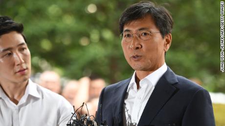 Ahn Hee-jung (right), a former South Korean presidential contender of the ruling Democratic Party, arrives at court for his sex abuse trial in Seoul on Tuesday.