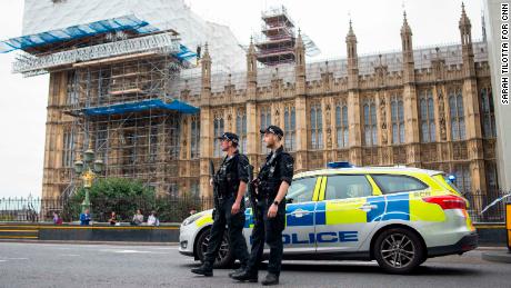 Police stand guard outside the Houses of Parliament following the incident.