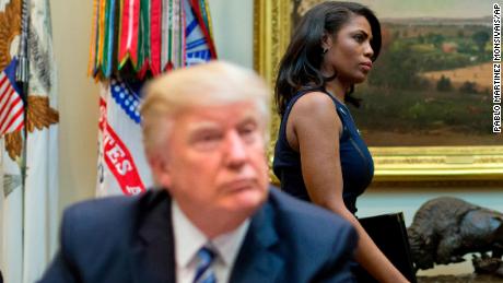 n this March 12, 2017 file photo, White House Director of communications for the Office of Public Liaison Omarosa Manigault, right, walks past President Donald Trump during a meeting on healthcare in the Roosevelt Room of the White House in Washington. (AP/Pablo Martinez Monsivais)