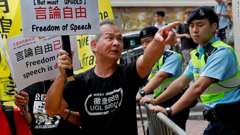 A protester shouts slogans in support of pro-independence activist Andy Chan as he delivers a speech at the Foreign Correspondents Club.