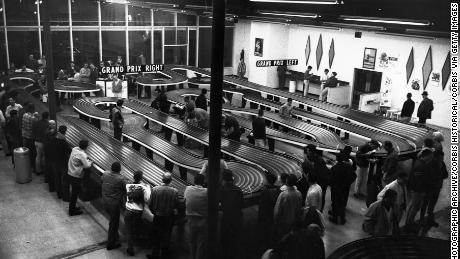 Before the proliferation of video games, crowds of men would gather to race slot cars in arcades like this one in San Francisco. 