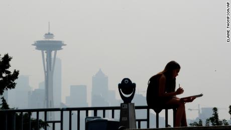 Smoky haze obscures the Space Needle and downtown Seattle on  August 14. 