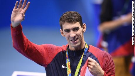 USA&#39;s gold medallist Michael Phelps waves after the podium ceremony of the Men&#39;s swimming 4 x 100m Medley Relay Final at the Rio 2016 Olympic Games at the Olympic Aquatics Stadium in Rio de Janeiro on August 13, 2016.   / AFP / Martin BUREAU        (Photo credit should read MARTIN BUREAU/AFP/Getty Images)