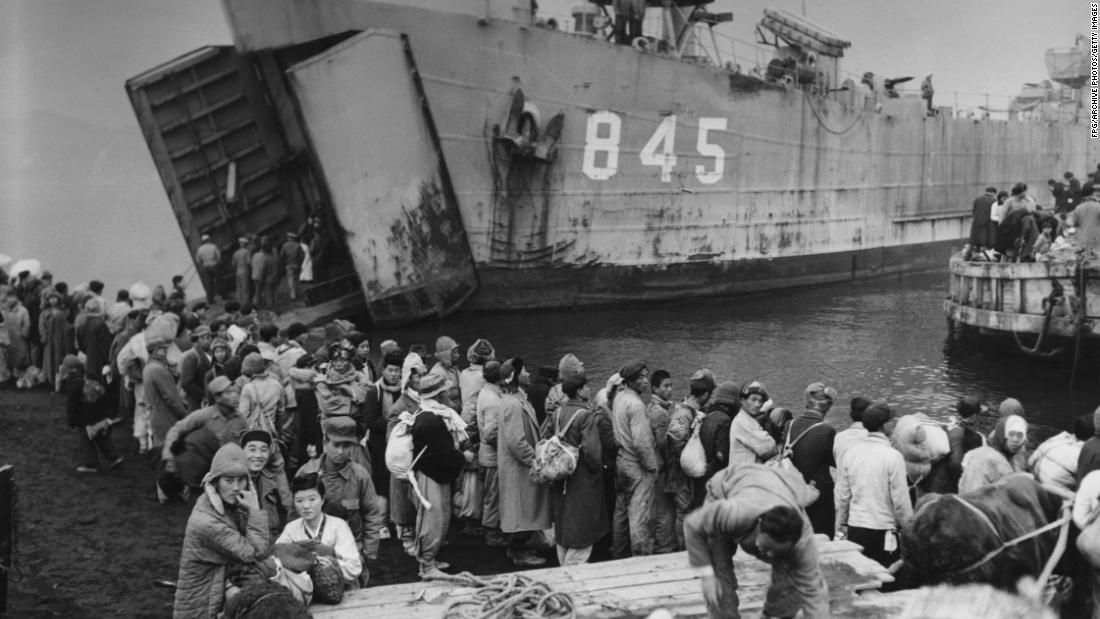 Civilians from Hungnam in North Korea board the landing ship USS Jefferson County as they flee their city during the Korean War on December 19, 1950.