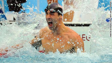 (FILES): This August 16, 2008 file photo shows US swimmer Michael Phelps reacting after winning the men&#39;s 100m butterfly swimming final at the National Aquatics Center during the 2008 Beijing Olympic Games in Beijing.  USA Swimming suspended Olympic superstar Michael Phelps for three months on February 5, 2009, a &quot;reprimand&quot; after a published photograph showed him apparently smoking marijuana.  The national governing body of the sport stressed that the punishment was not for a doping violation, but said they wanted to send a &quot;s trong message&quot; to Phelps about his status as a role model for young people.   AFP PHOTO / MARTIN BUREAU (Photo credit should read MARTIN BUREAU/AFP/Getty Images)