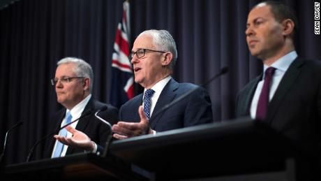 Malcolm Turnbull (center) speaks at a press conference with Treasurer Scott Morrison and Minister for Environment and Energy Josh Frydenberg on August 20.