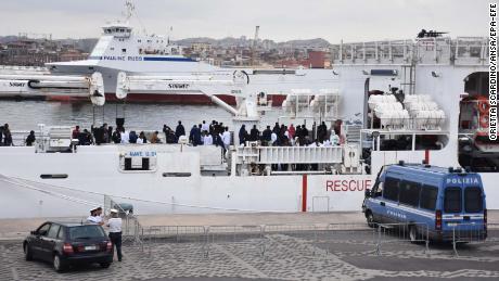Migrants are seen on board the Italian Coast Guard ship Ubaldo Diciotti moored in the port of Catania in Sicily.