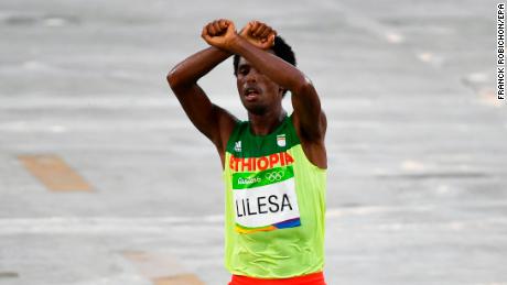 Feyisa Lilesa protests as he takes second place in the men's marathon race at the Rio 2016 Olympic Games.