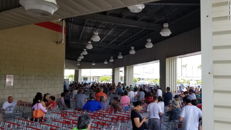 Residents brave the long lines outside a Costco store in Honolulu on Wednesday.