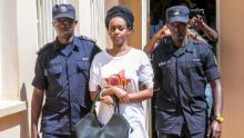 Diane Shima Rwigara (C), a prominent critic of Rwanda's President Paul Kagame, is escorted by Rwanda's Police officers as she arrives at the Nyarugenge intermediate court in Kigali on October 6, 2017. 
Rwigara was blocked from challenging Kagame in August's presidential election and she had been charged with inciting insurrection against the state as well as other offences.  / AFP PHOTO / Cyril Ndegeya        (Photo credit should read CYRIL NDEGEYA/AFP/Getty Images)