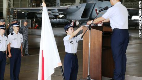 Misa Matsushima receiving her certificate from the Japan Air Self-Defense Force. 