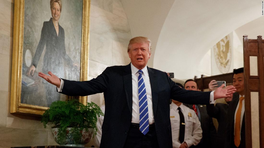 Trump, in front of a portrait of his 2016 opponent Hillary Clinton, &lt;a href=&quot;http://www.cnn.com/2017/03/07/politics/trump-white-house-tour-surprise/&quot; target=&quot;_blank&quot;&gt;surprises visitors&lt;/a&gt; who were touring the White House in March 2017. The tour group, including many young children, cheered and screamed after the president popped out from behind a room divider.