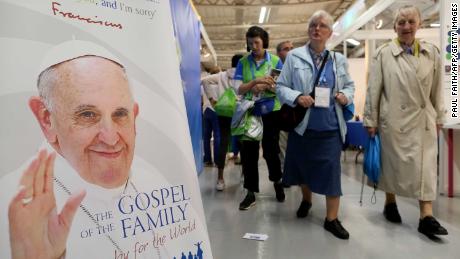 Visitors walk past merchandise on sale at the World Meeting of Families in Dublin.