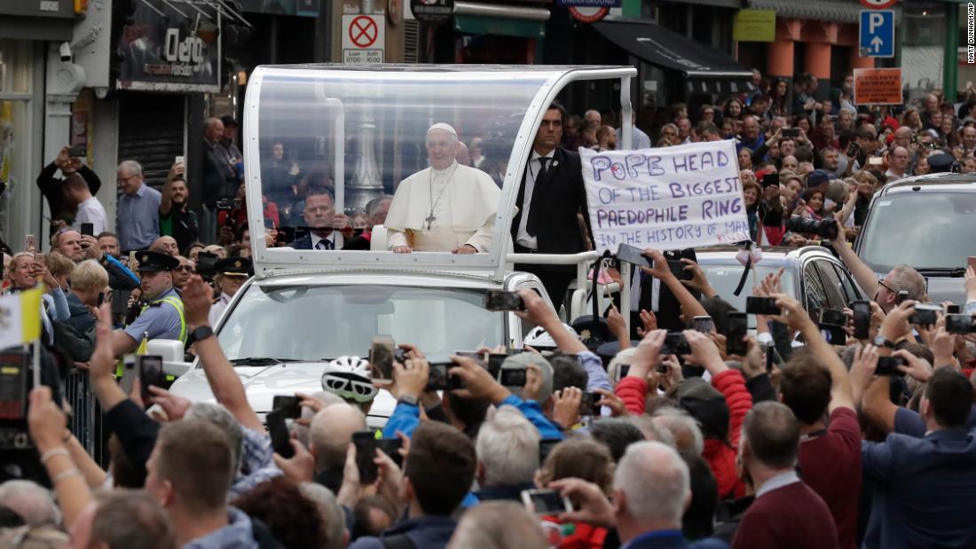 Pope Francis passes by a banner of a protester as he leaves St. Mary&#39;s Pro-Cathedral in Dublin on Saturday. The Pope spoke of his shame over the &quot;appalling crimes&quot; of historic child abuse in the Catholic Church and said outrage was justified. However, he failed to specifically mention the current scandal over a US grand jury report documenting at least 1,000 cases of clerical pedophilia.