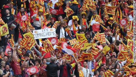 Catalans Dragons fans celebrate historic Challenge Cup victory over Warrington.