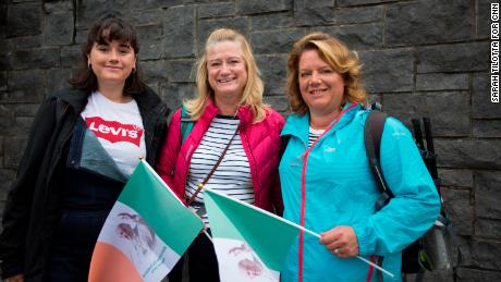 Aoibhin Meghen, 19, (left) with her mother Dearbhaile Heagney, 49, (right) and a friend on their way to the Papal Mass.