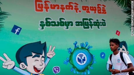 The Facebook logo is seen on an advertisement by a local telecom company in Yangon on June 7, 2018.